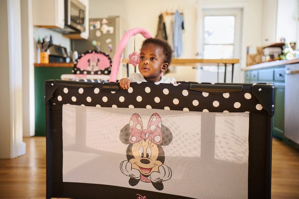 Disney Baby 3D Ultra Baby Play Yard with Bassinet and Toy Bar. Peeking Minnie